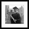 1950s smiling female graduate holding a diploma by Anonymous