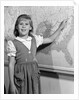 1960s school girl pointing to map of the USA by Anonymous