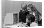 1980s boys and girl playing games on a computer by Anonymous