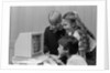 1980s boys and girl playing games on a computer by Anonymous