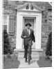 1950s smiling businessman walking out the front door of his house by Anonymous