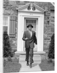 1950s smiling businessman walking out the front door of his house by Anonymous