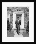 1950s smiling businessman walking out the front door of his house by Anonymous