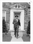 1950s smiling businessman walking out the front door of his house by Anonymous