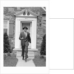 1950s smiling businessman walking out the front door of his house by Anonymous