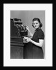 1930s 1940s portrait of female sales clerk at a cash register by Anonymous