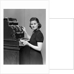 1930s 1940s portrait of female sales clerk at a cash register by Anonymous