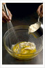 Adding hot rice to egg yolks by Anonymous