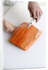 Deboning a salmon fillet by Anonymous