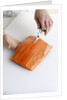 Deboning a salmon fillet by Anonymous