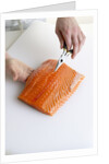 Deboning a salmon fillet by Anonymous