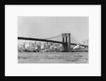 The Brooklyn Bridge spans the East River, ca. 1910. by Anonymous