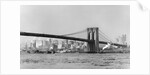 The Brooklyn Bridge spans the East River, ca. 1910. by Anonymous