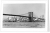 The Brooklyn Bridge spans the East River, ca. 1910. by Anonymous