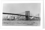The Brooklyn Bridge spans the East River, ca. 1910. by Anonymous