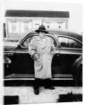 Mature man stands by his car, ca. 1942. by Anonymous