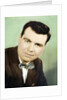 Mature man colorized studio portrait, ca. 1955. by Anonymous