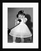 Young girl talks on the phone, ca. 1962. by Anonymous