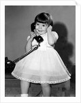 Young girl talks on the phone, ca. 1962. by Anonymous