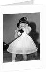 Young girl talks on the phone, ca. 1962. by Anonymous