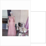 Grandma is all dressed up and standing next to a TV, ca. 1965 by Anonymous