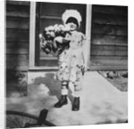 Young girl with a bouquet of flowers on her doorstep, ca. 1928. by Anonymous