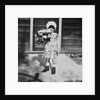 Young girl with a bouquet of flowers on her doorstep, ca. 1928. by Anonymous