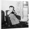Young boy in his living room, ca. 1946. by Anonymous