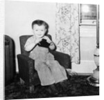 Young boy in his living room, ca. 1946. by Anonymous