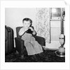 Young boy in his living room, ca. 1946. by Anonymous