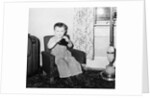 Young boy in his living room, ca. 1946. by Anonymous