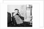 Young boy in his living room, ca. 1946. by Anonymous