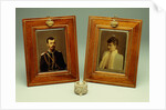 A pair of hand-coloured photos of Tsar Nicholas II & Alexandra and a cylindrical bowentie silver-mounted bell-push, marked Faberge by Anonymous