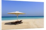 Parasol and recliner on the beach, Dubai by Anonymous