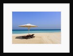 Parasol and recliner on the beach, Dubai by Anonymous