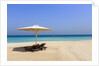 Parasol and recliner on the beach, Dubai by Anonymous
