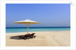 Parasol and recliner on the beach, Dubai by Anonymous