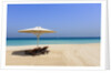 Parasol and recliner on the beach, Dubai by Anonymous