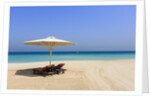 Parasol and recliner on the beach, Dubai by Anonymous