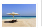 Parasol and recliner on the beach, Dubai by Anonymous
