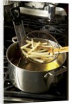 French fries in oil by Anonymous