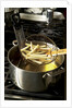 French fries in oil by Anonymous