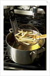 French fries in oil by Anonymous