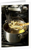 French fries in oil by Anonymous