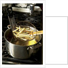 French fries in oil by Anonymous