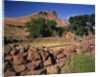 Stone corral fence and barn by Anonymous