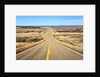 Long desert road stretching into the distance. by Anonymous