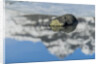 Rock with sky reflected in water. by Anonymous