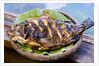 Grilled nila fish, served with banana leave by Anonymous