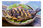 Grilled nila fish, served with banana leave by Anonymous